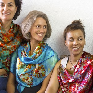 Women laughting and having fun with our silk scarves by Daba Disseny Barcelona - An elegant Christmas gift